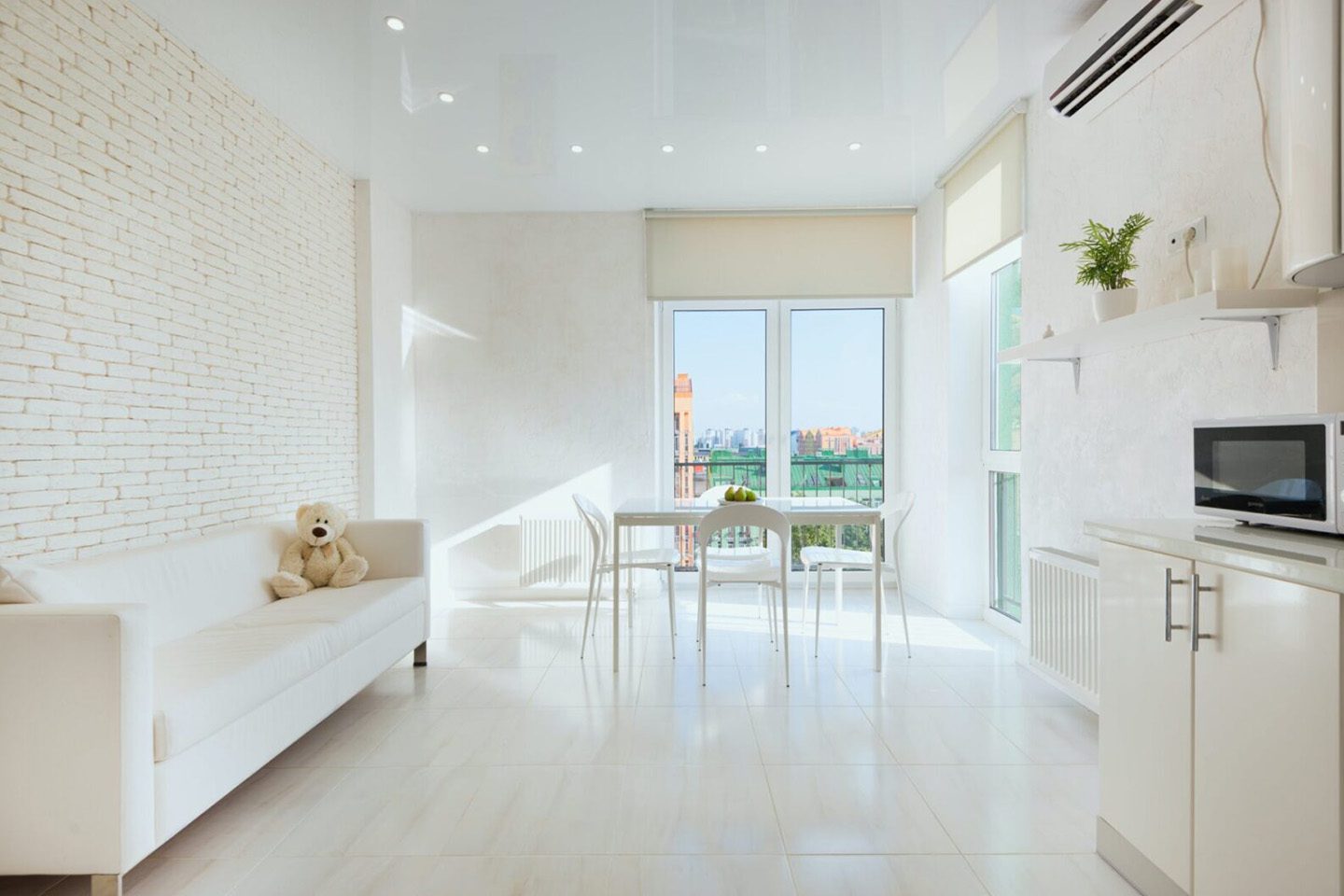 A living room with white walls and floors